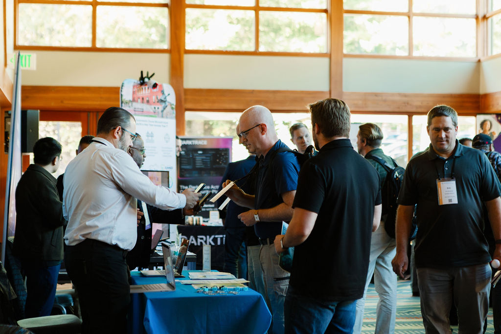 Attendees visiting partner tables in the Showcase